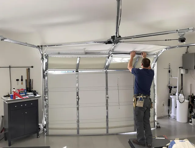 Bridgeport Garage Door Repair specialist performing precise section replacement on Bridgeport garage door
